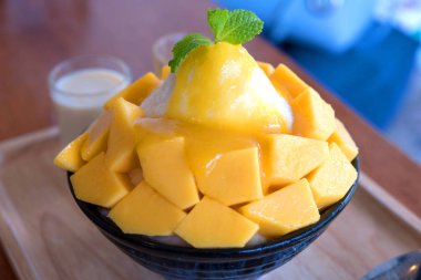 Bingsu (Kore Gıda) mango şekerli yoğunlaştırılmış süt ile görev yaptı.