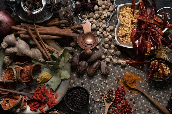 Spices and herbs on old kitchen table. Royalty Free Stock Images