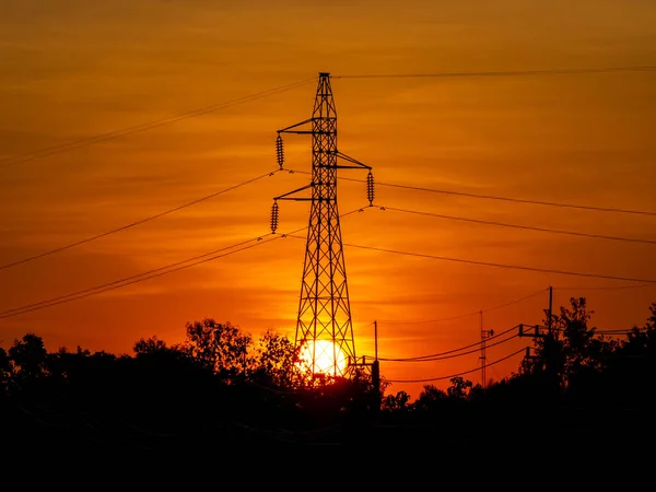 Elektrisk Pylon Vid Solnedgången Silhuett Högspänning Elektriskt Torn Solnedgången Tid — Stockfoto