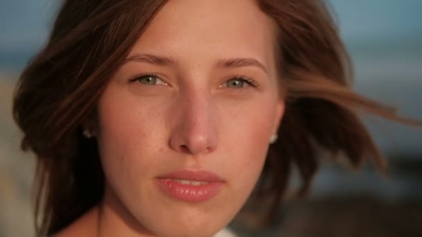 Portrait of a young woman with flying red hair and without makeup. — Stock Video