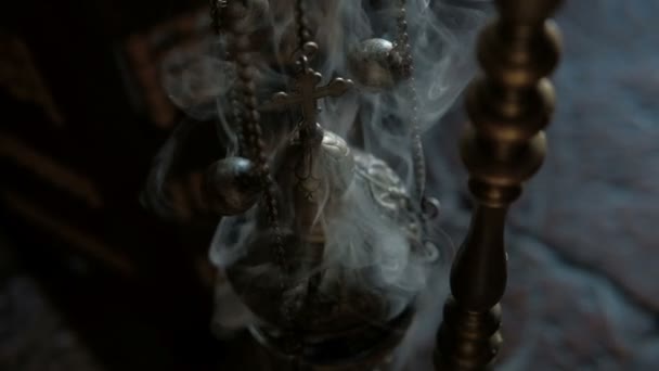 Smoke from incense and cross in Catholic church indoors. — Stock Video