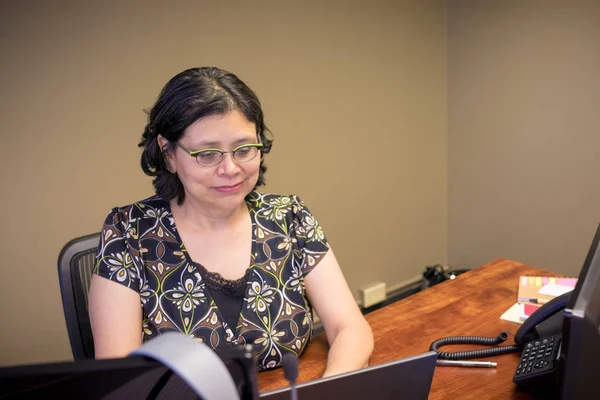 Hispanic Woman At Work Royalty Free Stock Images