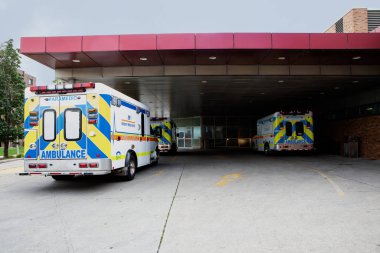 Ambulances Parked in Emergency Parking Bay Under Canopy
