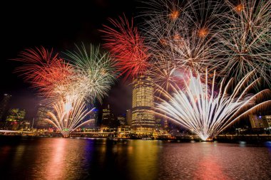 Colorful fireworks over night sky in Southbank  clipart