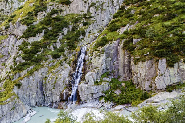 Waterfall on rocky mountains in Switzerland — Stock Photo, Image