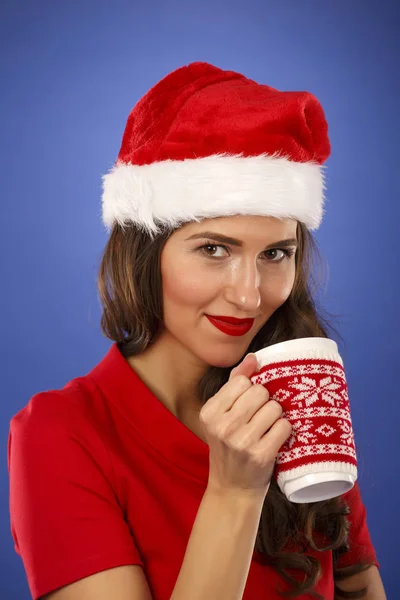 Christmas woman with a cup in hand — Stock Photo, Image