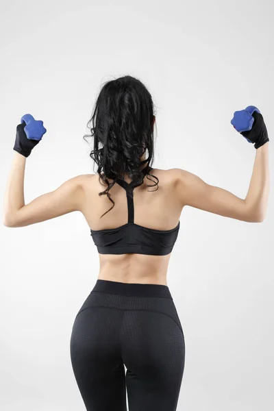 Woman with dumbbells doing different exercises — Stock Photo, Image