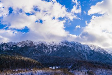 Beautiful winter landscape with Carpati Piatra Craiului mountain