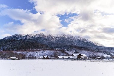 Beautiful winter landscape with Carpati Piatra Craiului mountain