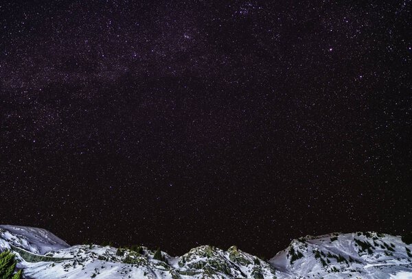 Sky night with stars in the mountains during the winter