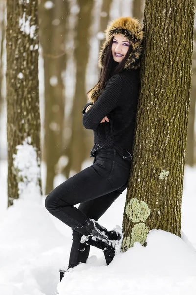 Winter portrait with a woman with colored eyes — Stock Photo, Image