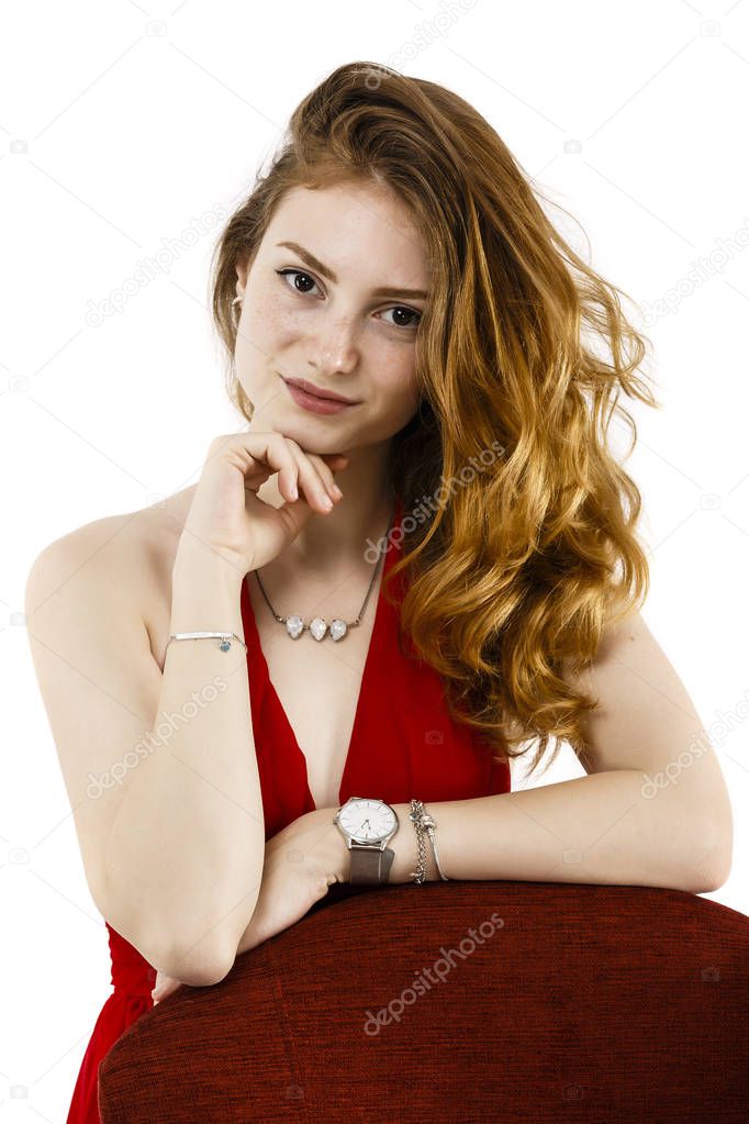 Portrait of a beautiful woman with red hair and freckles