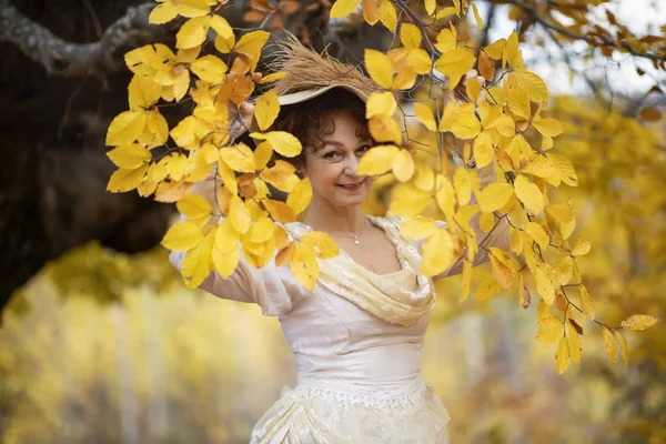 Portrait of a mature lady in a vintage dress, autumn time. — Stock Photo, Image