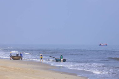 Da Nang, Vietnam - 16 January 2020: The traditional basket fishing boat docked at the beach.
