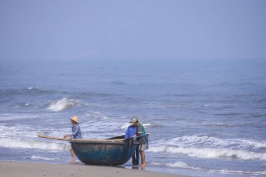 Da Nang, Vietnam - 16 January 2020: The traditional basket fishing boat docked at the beach.