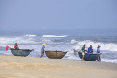 Da Nang, Vietnam - 16 January 2020: The traditional basket fishing boat docked at the beach.