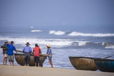 Da Nang, Vietnam - 16 January 2020: The traditional basket fishing boat docked at the beach.