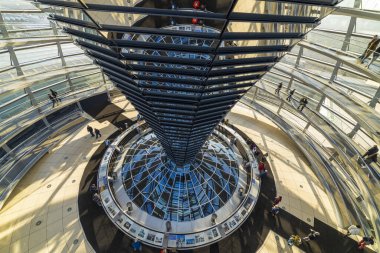 BERLIN, BERLIN / GERMANIA - February 7, 2020: Tourists visit the glass dome on the Reichstag. It was designed by architect Norman Foster and built to symbolize the reunification of Germany.