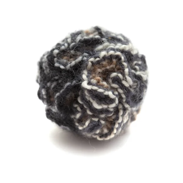 Knitted pompom of variegated yarn — Stock Photo, Image