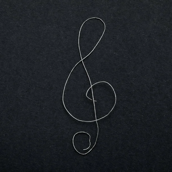 Signe musical clef sur papier noir — Photo