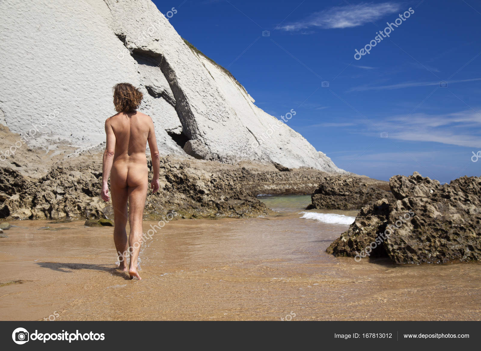 Cute nudist  Male nudist on Playa de Covachos beach — Stock Photo © Tamara_k #167813012