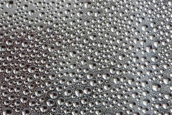 Fundo abstrato de gotas de água na superfície do vidro — Fotografia de Stock