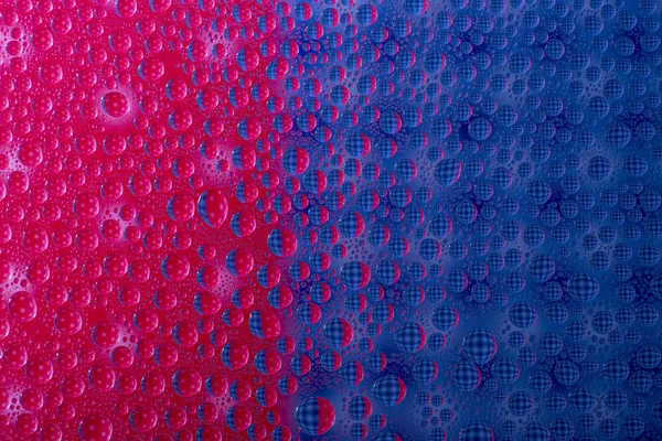 Colorful abstract of water drops on a glass surface — Φωτογραφία Αρχείου