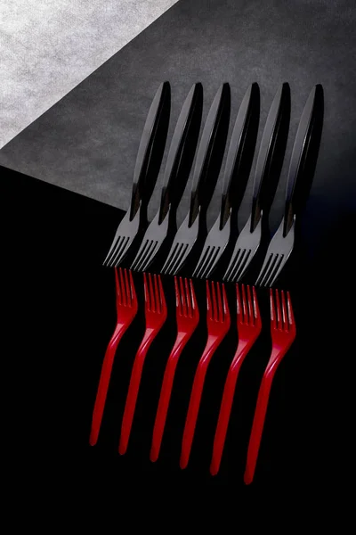 Still life with red and black forks — Stock Photo, Image