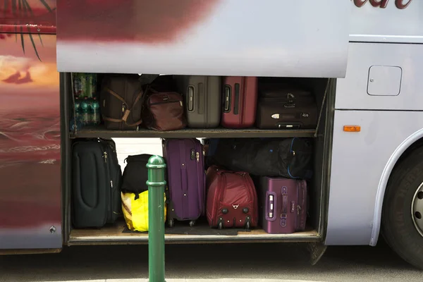 Bags and suitcases in the luggage compartment on a tourist bus