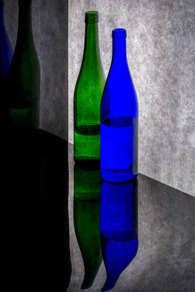 Still Life Colored Bottles Reflective Surface — Stock Photo, Image