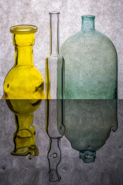 Still Life Colored Bottles Reflective Surface — Stock Photo, Image