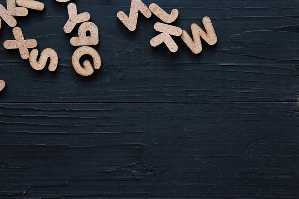 Close up wooden alphabet study english letter,ABC on the blackbroad as a background composition