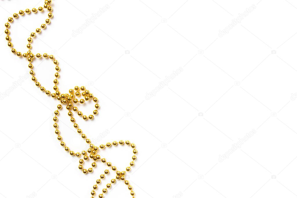 Golden beads isolated on white. Christmas frame