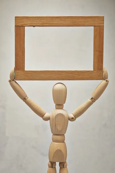 Wooden mannequin with frame