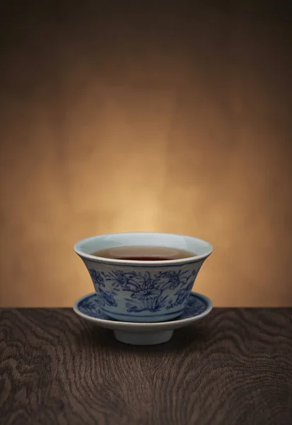 Traditional tea ceremony accessories, teacup with wooden background — Stock Photo, Image