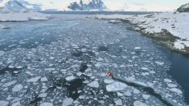 Zodiac boat in Antarctica ocean aerial shot
