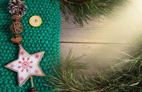 Christmas decoration snowflake on wooden background woolen textu — Stock Photo, Image
