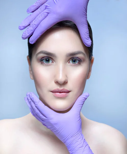 woman beauty face hands gloves lifting