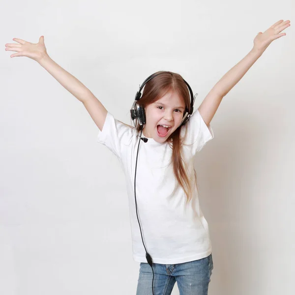 Fashion little girl with headphone singing