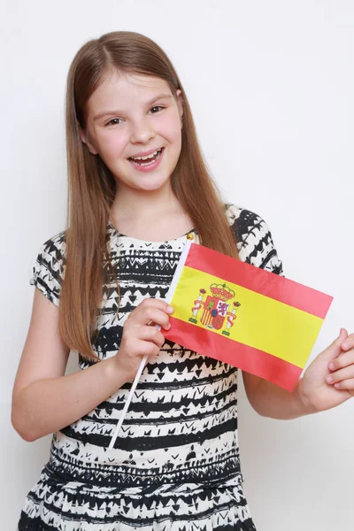 Beautiful teen girl and Spanish flag (flag of Spain)