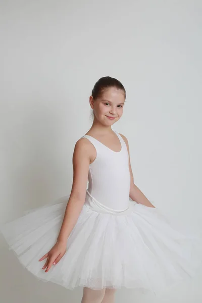 Beautiful little ballerina in studio