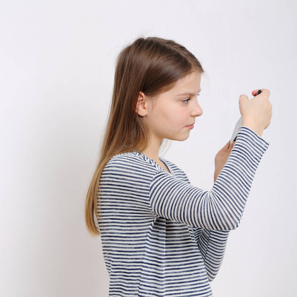 School teen holding mobile phone (smartphone)