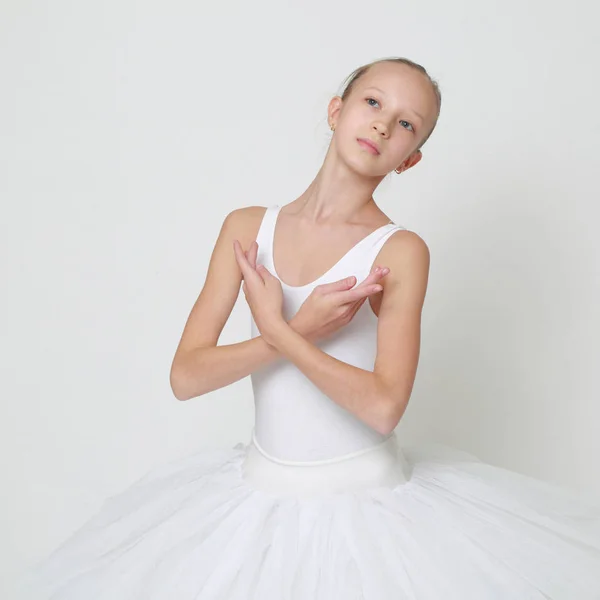 Beautiful little ballerina in studio