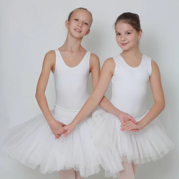 caucasian teen ballerinas over white background