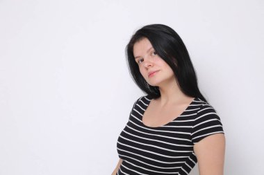 Funny emotional caucasian woman studio portrait/Joyful woman posing on camera