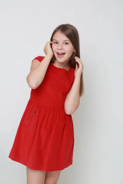 Emotional Little Girl Wearing Red Dress — Stock Photo, Image