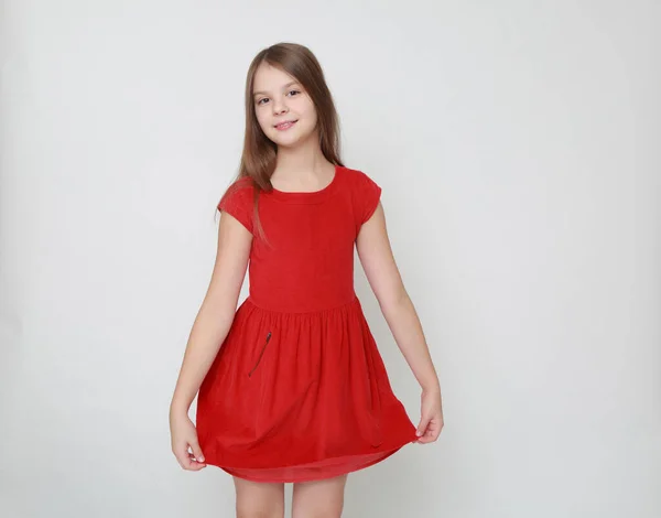 情感小女孩穿红色礼服 — 图库照片