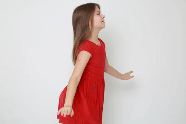 Emotional Little Girl Wearing Red Dress — Stock Photo, Image