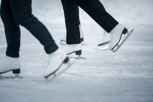 Young woman ice skating outdoors on a pond — Stock Photo, Image