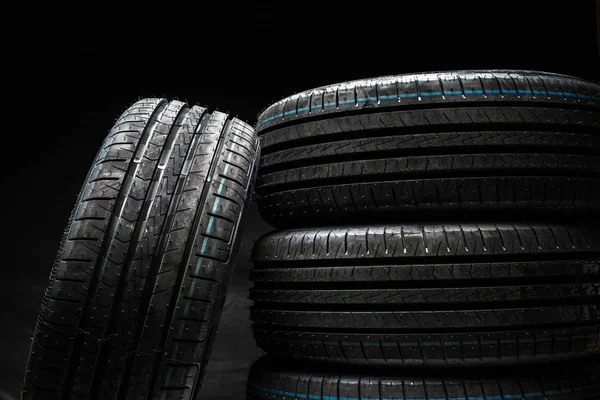 Stack of brand new high performance car tires — Stock Photo, Image